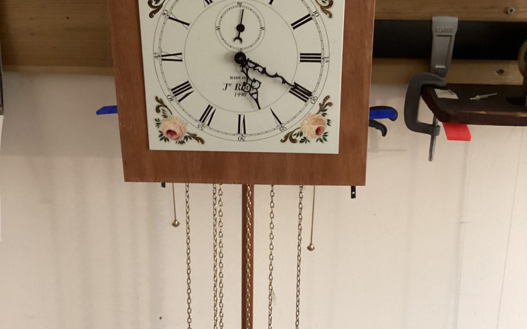 Traditional wooden cuckoo clock hanging on interior wall
